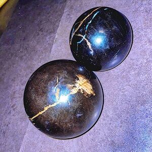 Petrified wooden bram balls, decorative spheres by “Made Good” home goods.